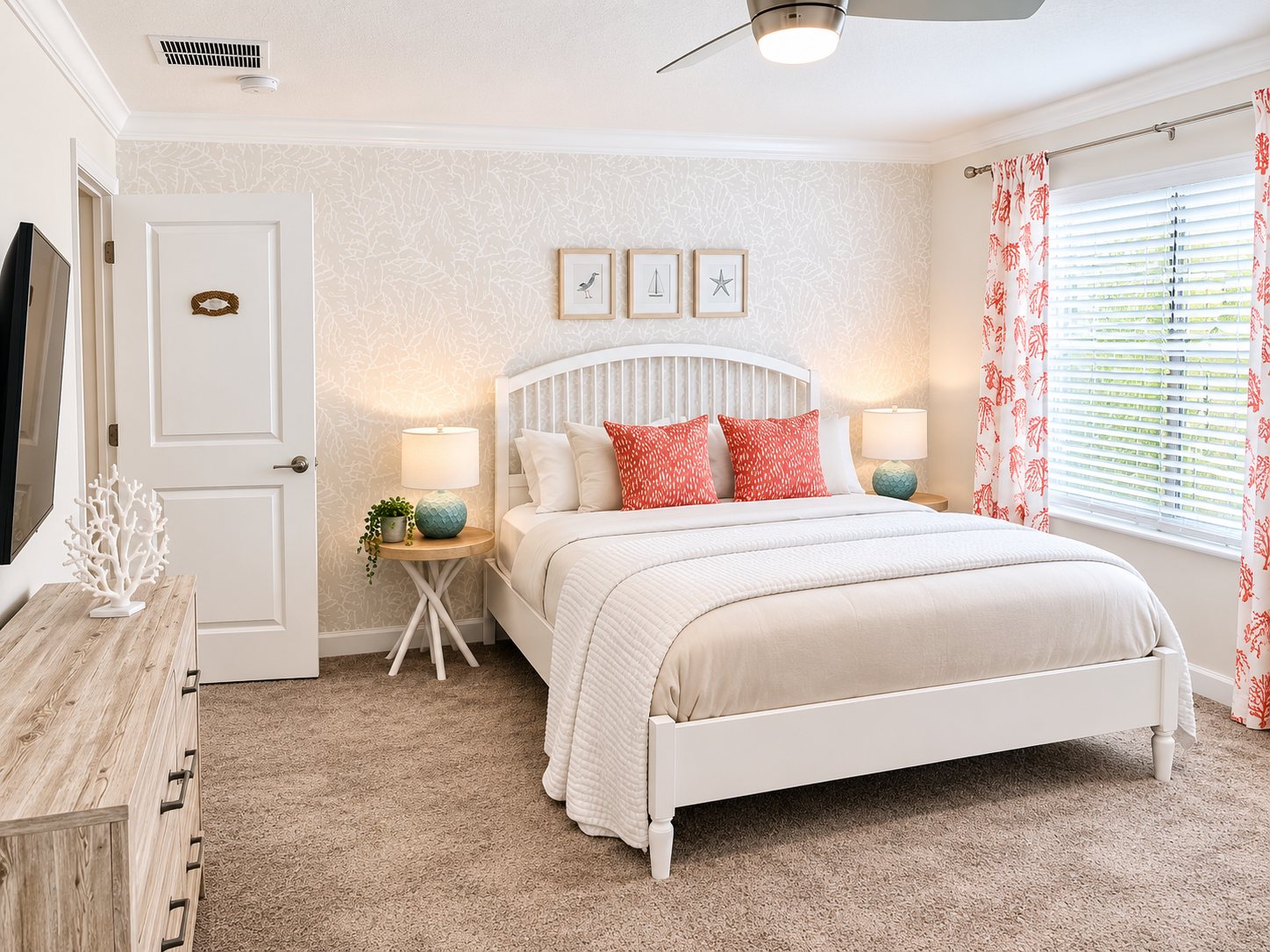 Coastal guest bedroom with coral accents styled for a vacation rental listing