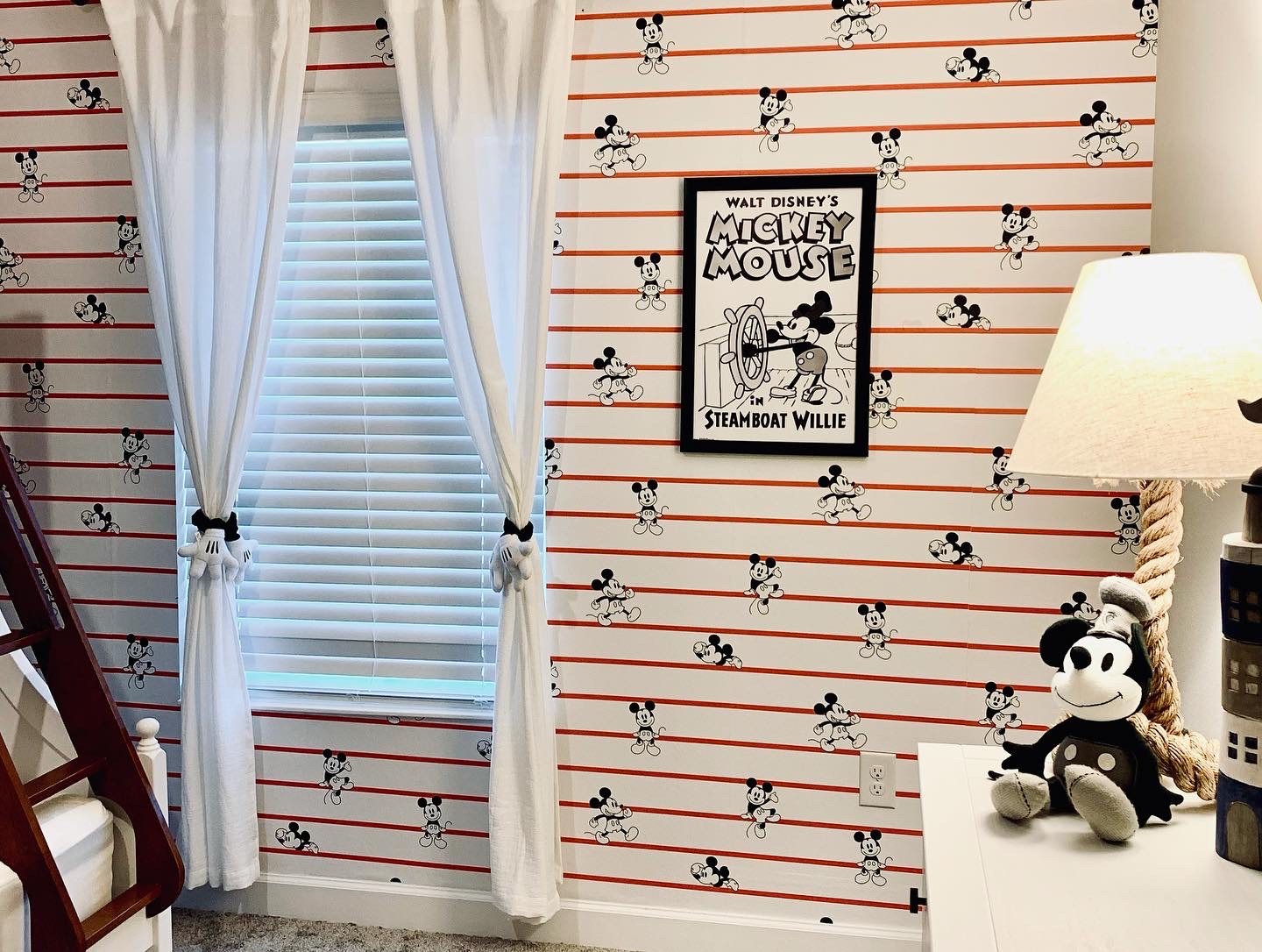 Striped feature wallpaper with framed print and rope lamp detail